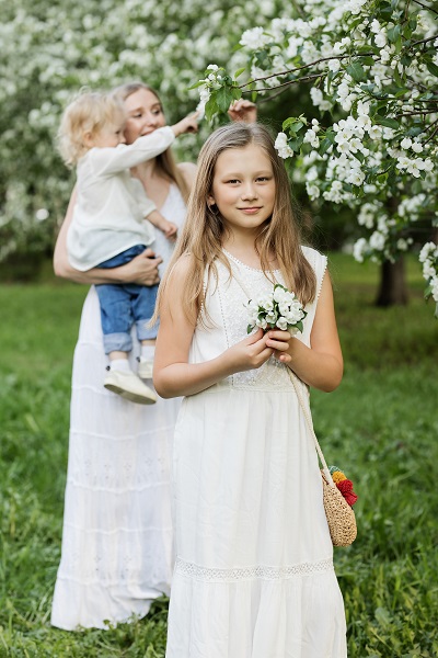 girl dressed in white at the ceremony