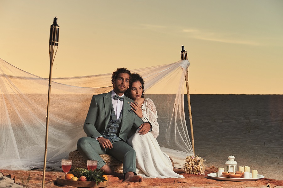 plain green groom suit with waistcoat and bow tie